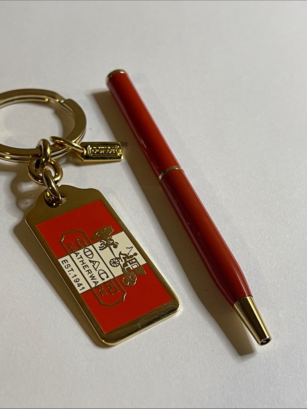 Coach Red and Gold Enamel Keychain Tag with Coach Pen